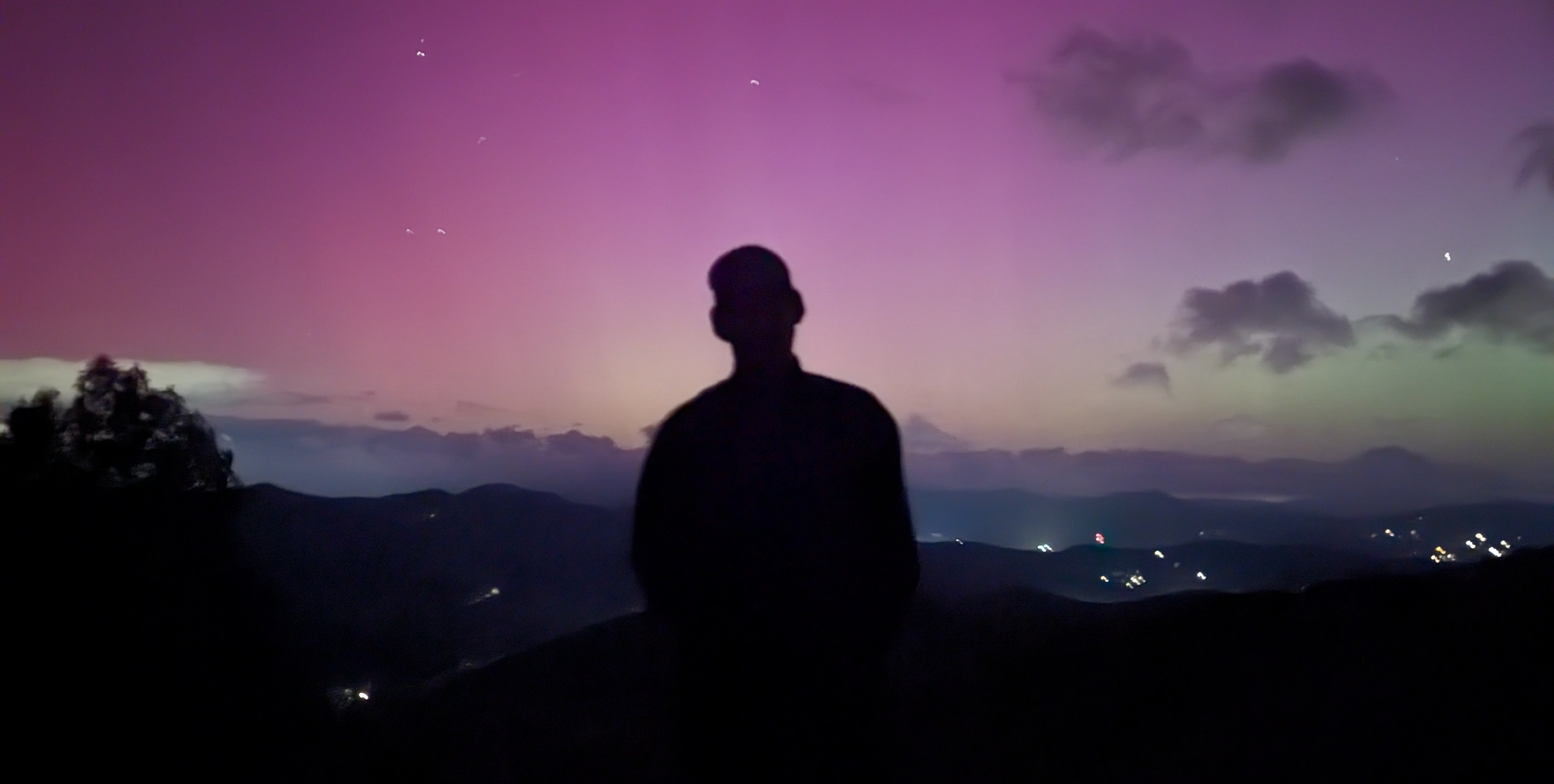 Image of me silhouetted against the aurora borealis